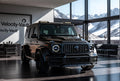 Velocity-Vault | Matte Black Brabus G63 in Modern Mountain Living Room – Luxury Digital Wallpaper Pack